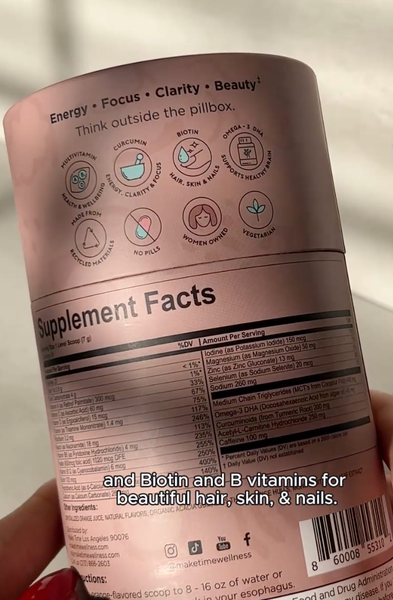 Supplement container with 'Supplement Facts' label held by a hand of the BBB Powder by Make Time Wellness