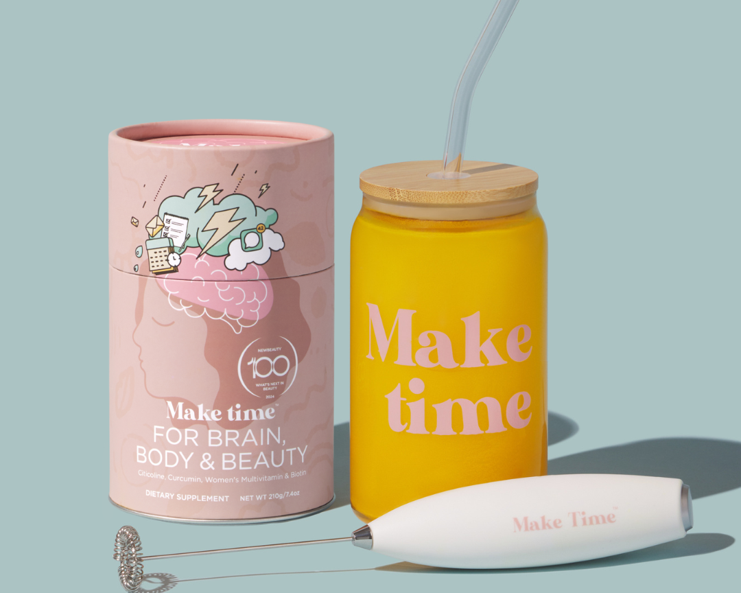 A product image featuring a pink cylindrical container with a brain illustration and text reading 'Make time for Brain, Body & Beauty', alongside a yellow glass tumbler cup with a bamboo lid and a white USB-rechargeable drink mixer with the text 'Make Time'.