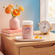 Make Time Brain & Beauty Gummy jar on a nightstand with flowers