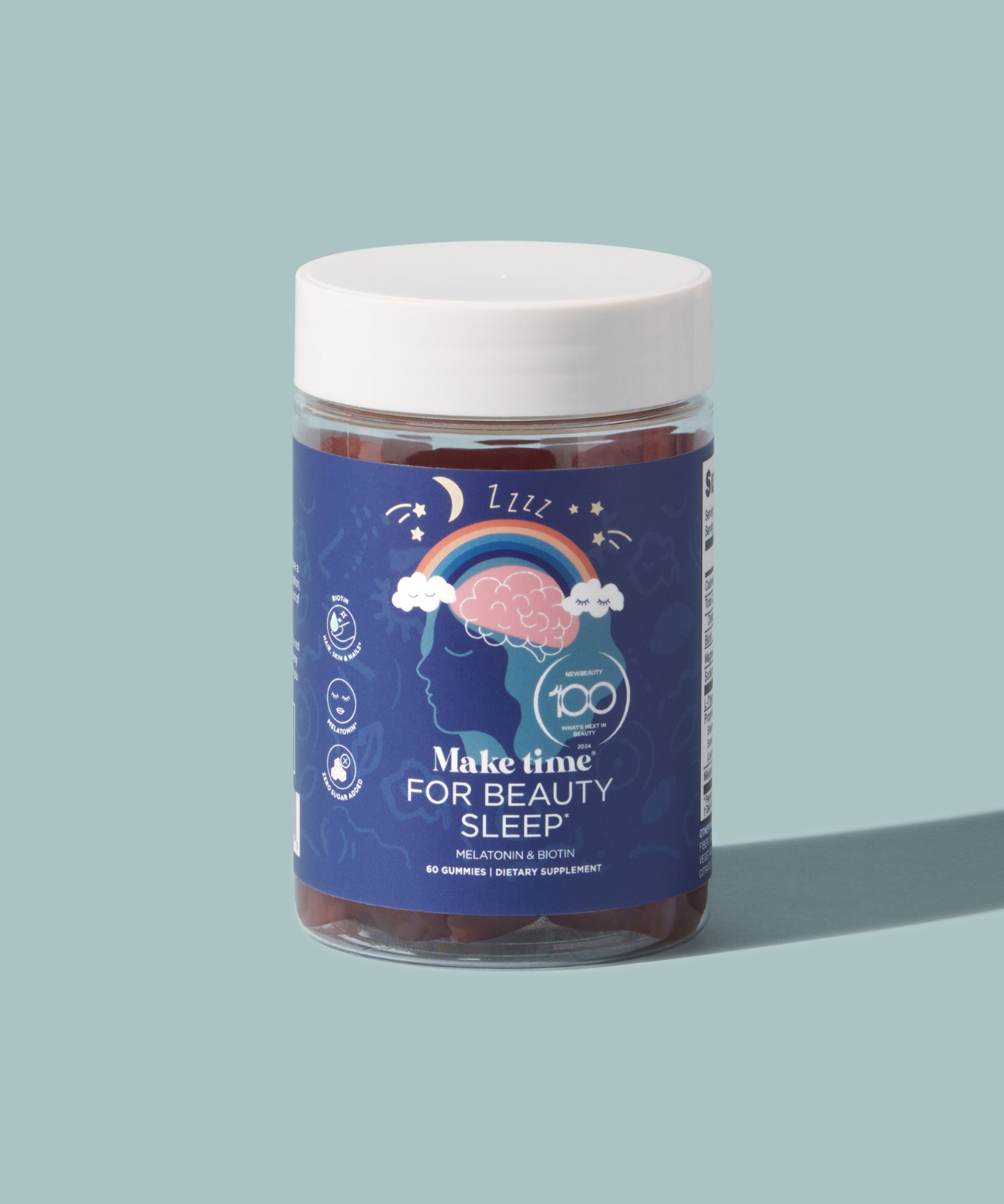 A clear jar containing blue gummies labeled 'Make Time for Beauty Sleep', indicating a sleeping aid supplement.