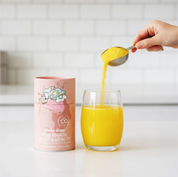 Make Time Brain, Body & Beauty powder being poured into a glass