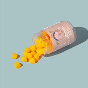 Make Time Brain & Beauty Gummy jar spilling orange gummies