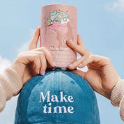 Woman holding a Make Time Brain, Body & Beauty powder canister